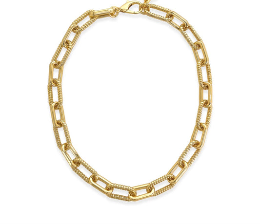 Paperclip chain necklace with alternating ribbed link design, 18k gold plated. Approx. 0.5" thick, 16" length with 2" extension, lobster clasp closure. Wear with matching bracelet for a complete look